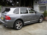 Porsche Cayenne with damaged O/S panels