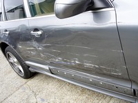 Porsche Cayenne with damaged O/S panels